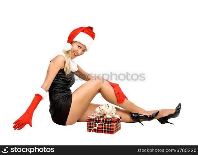 Pin-up Girl in a Santa Costume Sitting with Christmas Present&#xA;on a white background