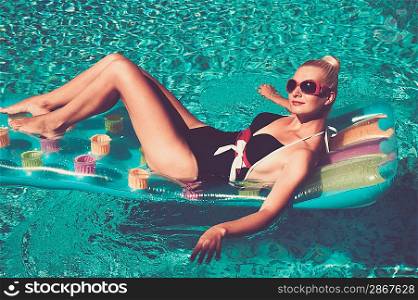 Pin up girl in the swimming pool