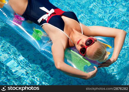 Pin up girl in the swimming pool