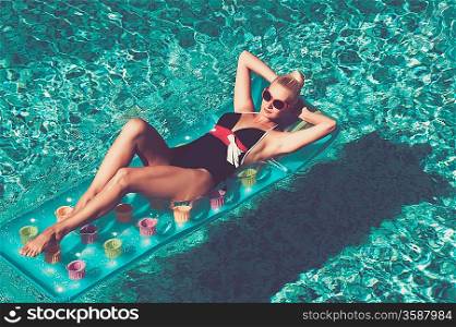 Pin up girl in the swimming pool