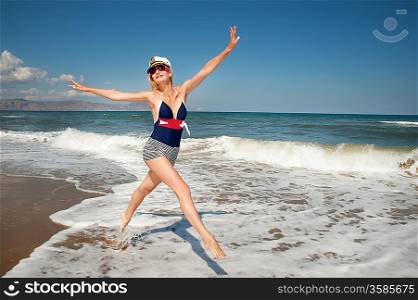 Pin up girl running in a sea