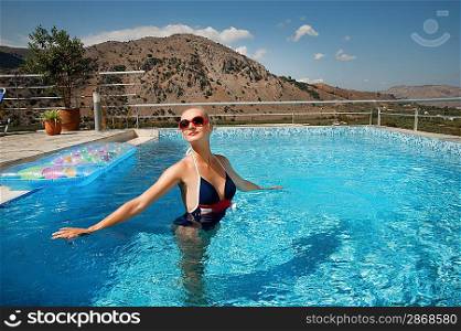 Pin up girl standing in a pool