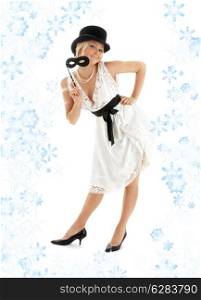 pin-up image of pretty lady with black mask and snowflakes