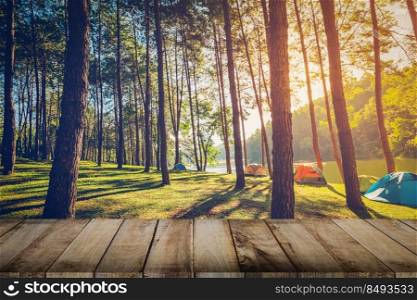 Pine tree forest and wood plank floor with sunrise. Vintage style.
