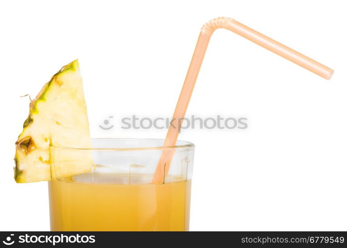 Pineapple and glass of juice. Studio shot