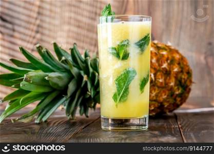 Pineapple and Mint Caipirinha cocktail garnished with mint
