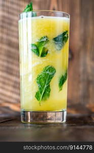 Pineapple and Mint Caipirinha cocktail garnished with mint