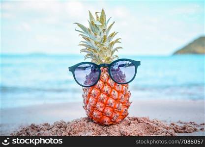 Pineapple And Sun Glasses On Beach st Sea Summer Background Concept