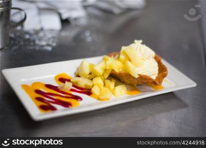 Pineapple ice cream dessert in a commercial kitchen