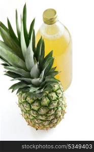 Pineapple next to pineapple juice