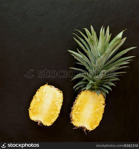 pineapple on the black texture background. .have a lot of fiber,vitamins C and minerals. food, fruits or healthcare concept.