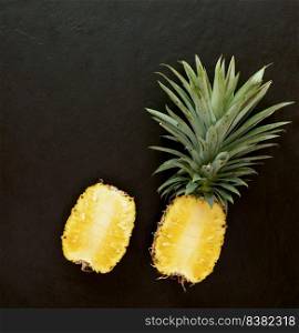 pineapple on the black texture background. .have a lot of fiber,vitamins C and minerals. food, fruits or healthcare concept.