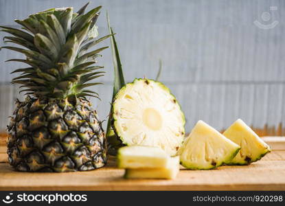 pineapple slice on wooden table / Fresh pineapple summer fruit