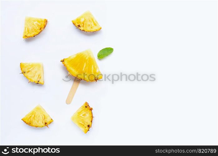 Pineapple slices on white background.