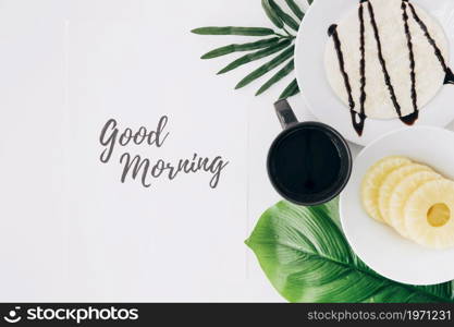 pineapple slices tortillas coffee leaves with good morning text paper white background. High resolution photo. pineapple slices tortillas coffee leaves with good morning text paper white background. High quality photo