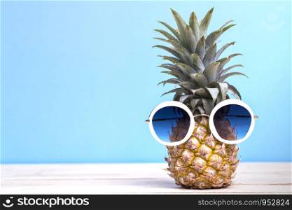 Pineapple with Sunglasses Fashion Summer Party and Holiday concept