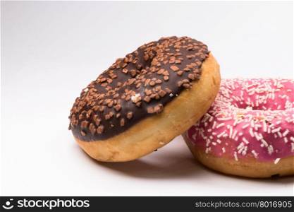 pink and brown donuts on white