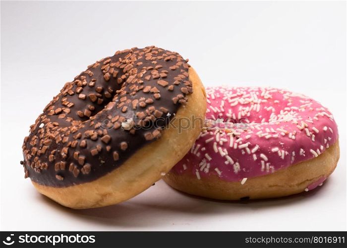 pink and brown donuts on white