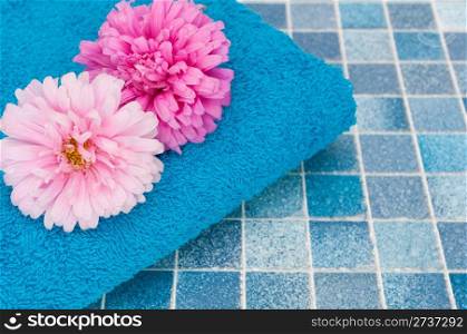 Pink and Violet Dahlia Flowers and Blue Bath Towel on Blue Bathroom Tiles