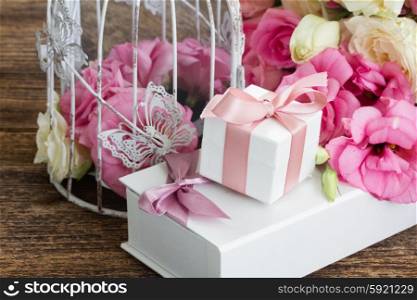 pink and white flowers. pink and white fresh roses and eustoma flowers with gift box
