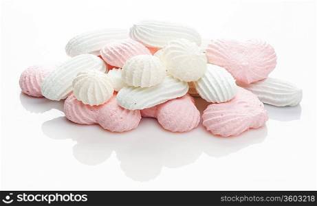 pink and white meringue cake on white background
