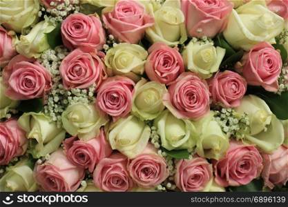 Pink and white roses in a floral wedding decoration