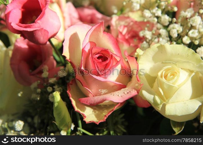 Pink and white roses in a mixed bridal bouquet