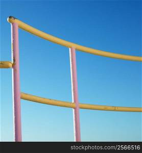 Pink and yellow painted railings of lifeguard tower on beach in Miami, Florida, USA.