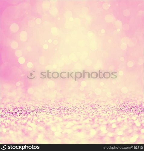 Pink and Yellow Sparklng Defocused Holiday Background of Lights.