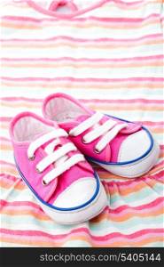 Pink baby footwear - gymshoes on dress