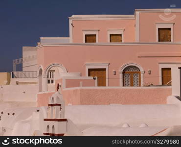 Pink building in Santorini Greece