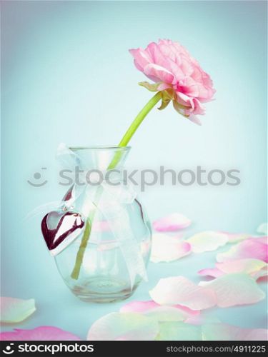 Pink buttercups in glass vase with heart, love card, toning