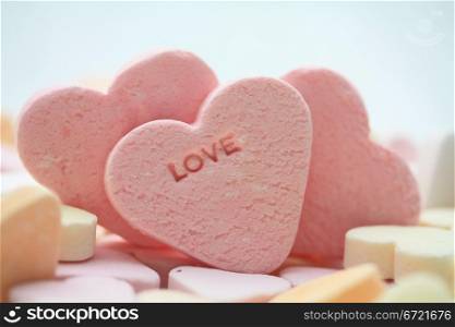 pink candy hearts with the word love