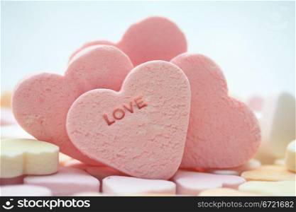 pink candy hearts with the word love