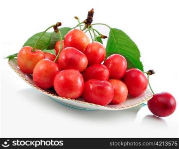 pink cherries on a plate