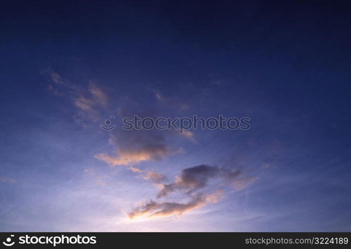 Pink Clouds In A Dark Purple Sky