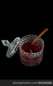 Pink Cocktail glass with ice at a bar counter