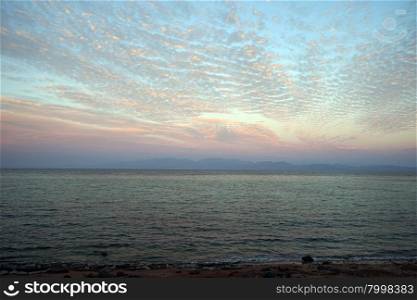 Pink color clouds on the sky and sea in Dahab, Egypt