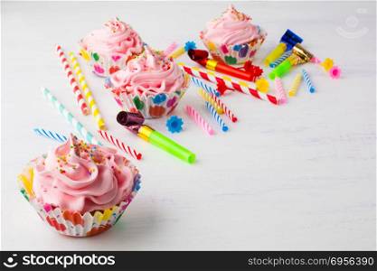 Pink cupcakes and candles birthday background. Pink cupcakes and candles birthday background . Birthday cupcakes. Gourmet cupcakes. Sweet dessert. Sweet pastry. Birthday invitation. Birthday mockup. Styled desktop. Birthday background.