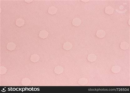 Pink decorative fabric mesh with patterns of circles as background or texture. Sample material.. Pink decorative fabric mesh with patterns of circles as background or texture. Sample material