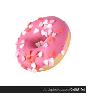 Pink donut with heart sprinkles decoration. Valentine&rsquo;s day love sweet cute glazed dessert. Isolated donut flying tilted angle horizontally.