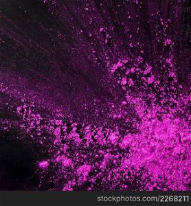 pink dust particles splash against black background