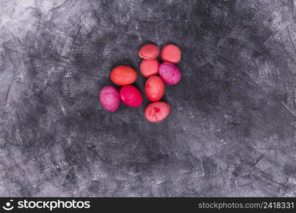 pink easter eggs with macaroons table