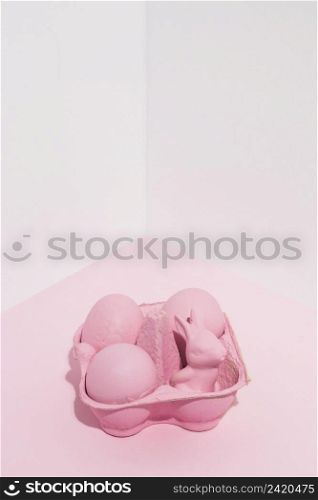 pink easter eggs with small rabbit rack