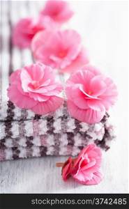 pink flowers and towel for spa