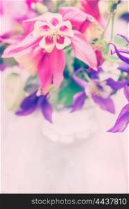 Pink garden flowers in glass, romantic card, toned