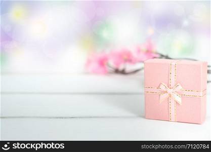 Pink gift boxes on the white background with copy space for season greeting Merry Christmas or Happy New Year