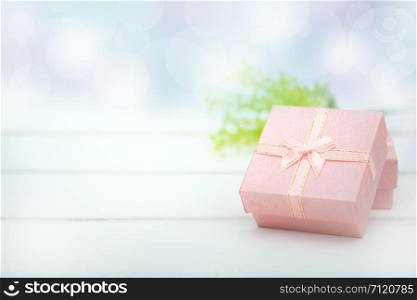 Pink gift boxes on the white background with copy space for season greeting Merry Christmas or Happy New Year