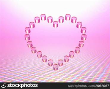 Pink glass balls shaped as a heart on a pink background