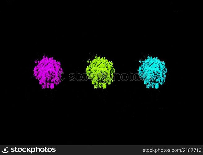 pink green turquoise holi colors arranged row black background